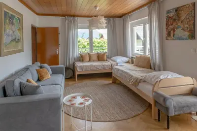 a living room with two couches and a table at Mia Dream in Bled