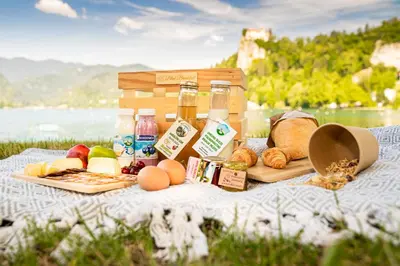 a picnic with bread and food on a blanket at Mia Dream in Bled