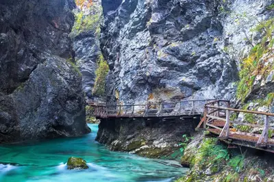a bridge over a river in a canyon at Mia Dream in Bled