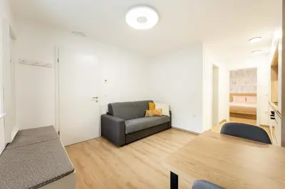 a living room with a couch and a table at Apartments Gros in Radeče