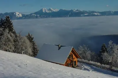 a cabin on top of a snow covered slope at Private Cottage near Ljubljana in Škofja Loka