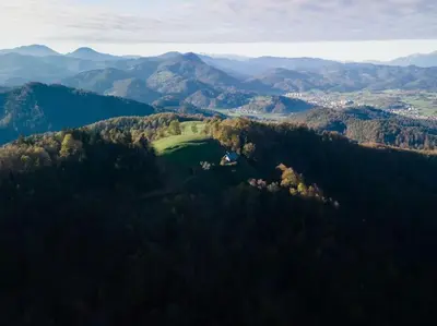 an aerial view of a golf course in the mountains at Private Cottage near Ljubljana in Škofja Loka