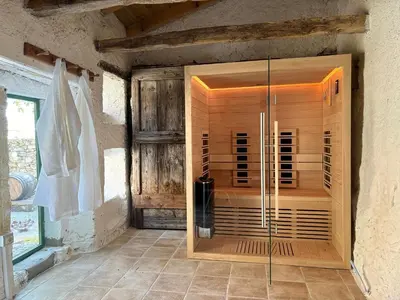a shower in a room with a glass enclosure at Karst Heritage Retreat in Štanjel