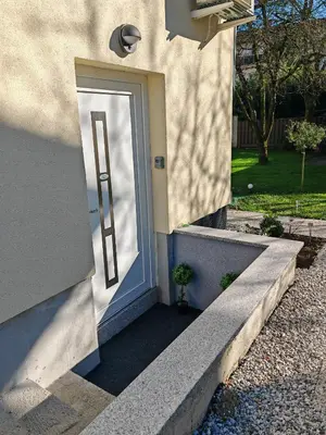 a door to a house with a stairway at Blue apartment with FREE parking in Ljubljana