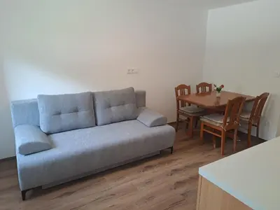 a living room with a couch and a table at Apartment Danica in Kranjska Gora