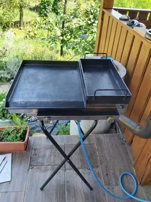 a grill sitting on a table on a porch at Apartment in Grabrovec - Koroska Unterkärnten 44968 in Metlika