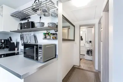 a kitchen with a counter top with a microwave at Ljubljana sLOVEnia + FREEparking & Bikes in Ljubljana