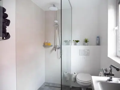 a bathroom with a shower and a toilet and a sink at Ljubljana sLOVEnia + FREEparking & Bikes in Ljubljana