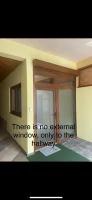 a sign that says there is no external window only to the hallway at Apartmaji Winter Garden Kranjska Gora in Kranjska Gora