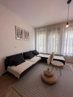 a living room with a couch and a table at Apartmaji Winter Garden Kranjska Gora in Kranjska Gora