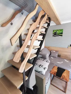 a spiral staircase in a tiny house at Cosy Retreat Čatež in Čatež ob Savi