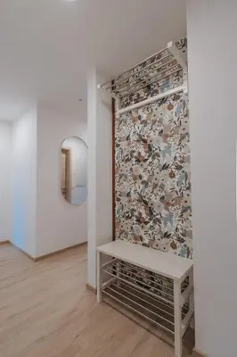 a room with a bench in front of a wall at APARTMA LAMBERGER in Žirovnica