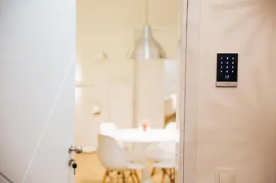 a room with a table and a door with a lightswitch at Apartment Center II - Kersnikova in Ljubljana