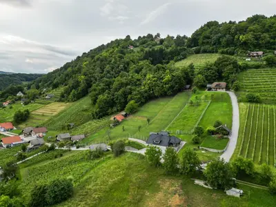 an aerial view of a village on a hill with a road at Vineyard cottage Jelenov hrib in Smarjeske Toplice