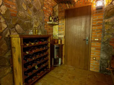 a room with a door and a wine cellar at Vineyard cottage Jelenov hrib in Smarjeske Toplice