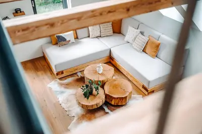 an overhead view of a living room with a couch and a table at Goat's Paradise in Bohinj