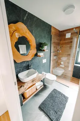 a bathroom with a toilet and a sink and a shower at Goat's Paradise in Bohinj