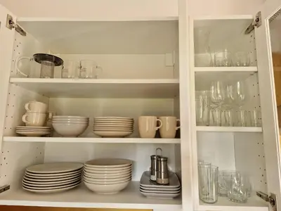 a cabinet filled with plates and cups and dishes at Holiday home Melisa in Mozirje