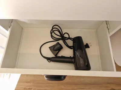 a black appliance in a drawer in a room at Holiday home Melisa in Mozirje