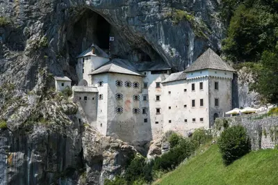 a castle on the side of a mountain at Apartma Relax in Prestranek