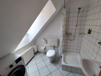 a white bathroom with a sink and a toilet at MaLu apartment in nature with terrace in Jakovica