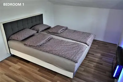 a bed with three pillows on it in a room at ARIA DELUXE Mobile Homes with Terme Čatež Tickets in Čatež ob Savi