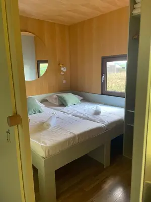 a bed in a small room with a window at BIG BERRY Kolpa - Isabella Premium House in Gradac