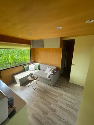 a living room with a couch and a table at BIG BERRY Kolpa - Isabella Premium House in Gradac