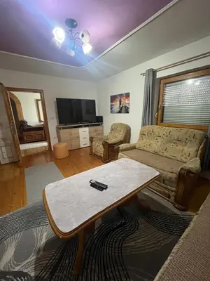 a living room with a couch and a coffee table at Apartment GREEN HOUSE in Šempas