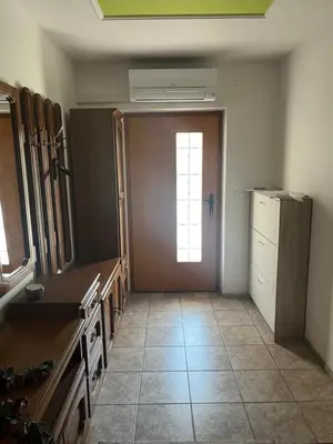 a large kitchen with a door and a window at Apartment GREEN HOUSE in Šempas