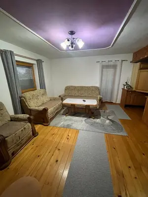 a living room with a couch and a coffee table at Apartment GREEN HOUSE in Šempas