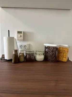 a kitchen counter with jars of food and nuts at Granny's Vintage Chic in Maribor