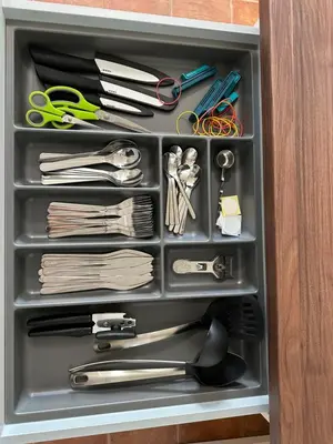 a drawer with scissors and other items in it at Granny's Vintage Chic in Maribor
