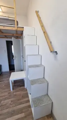 a set of stairs in a room with a table at PARIS in Ljubljana