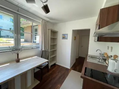 a kitchen with a counter and a sink and a window at Apartma FIREFLY2 in Ljubljana