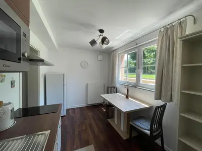 a small kitchen with a table and a window at Apartma FIREFLY2 in Ljubljana