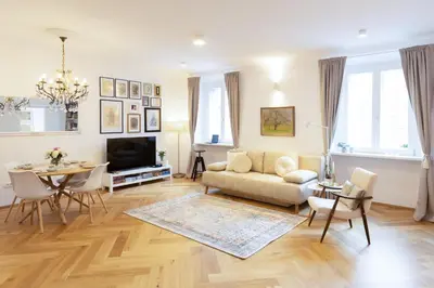 a living room with a couch and a table at Stylish Apartment in Historical Center in Ljubljana