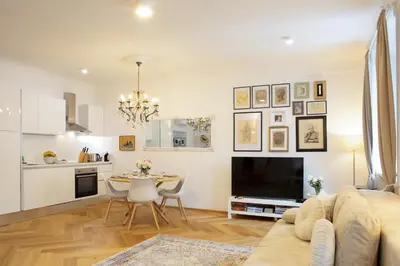 a living room with a couch and a table at Stylish Apartment in Historical Center in Ljubljana