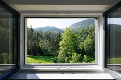 an open window with a view of the mountains at Holiday House Chilly in Kotlje