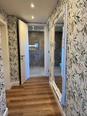 a hallway with a door and a mirror at Vila Urbana Luxury Apartments in Lesce