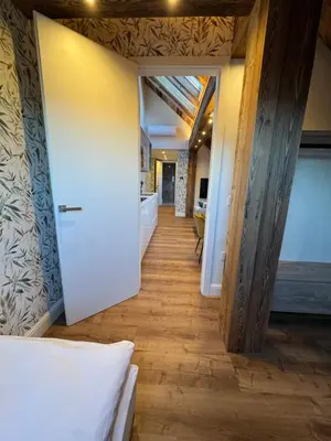 a hallway leading to a room with a ceiling at Vila Urbana Luxury Apartments in Lesce