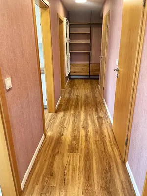 a hallway of an empty room with wooden floors at Vila Urbana Luxury Apartments in Lesce