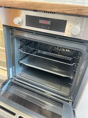a microwave oven with its door open in a kitchen at Vila Urbana Luxury Apartments in Lesce