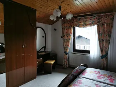 a bedroom with a bed and a window at Apartment Žvab in Bohinj