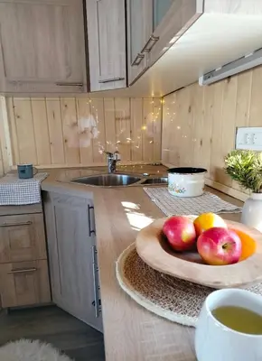 a kitchen with a plate of fruit on a counter at Koča Velika Planina - Chalet Kamrica in Stahovica