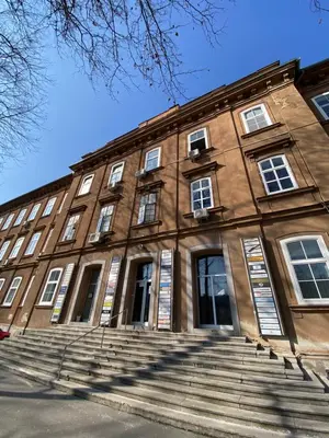 a large brick building with stairs in front of it at The Amazing Loft in Ljubljana