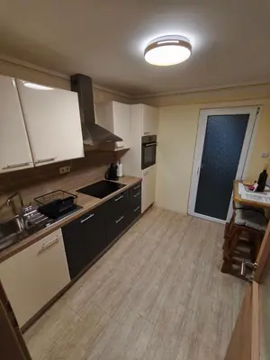 a kitchen with a sink and a stove top oven at Guesthouse and Wellness VINEA in Spodnji Ivanjci