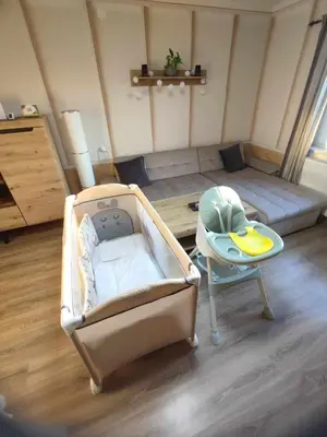 a room with a bed and a table in a room at Guesthouse and Wellness VINEA in Spodnji Ivanjci