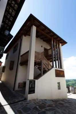 a building with a staircase on the side of it at Vinoteka Brda in Šmartno