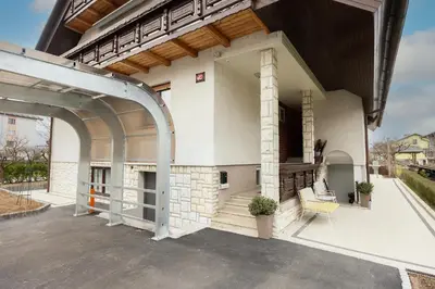an outdoor patio of a house with an archway at Papas Apartment in Lesce